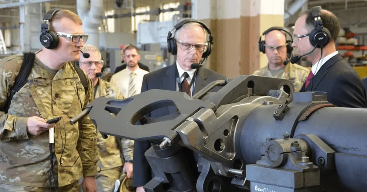 Bruce Jette (center), assistant secretary of the Army for acquisition, logistics and technology, gets a briefing on product improvements for cannon systems.