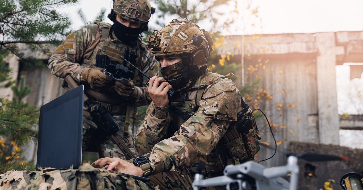 Military men using a drone during an operation